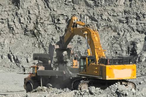 Excavator working at an open-pit mine